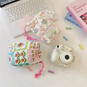 Quilted cotton drawstring pouch for cameras and accessories with floral patterns