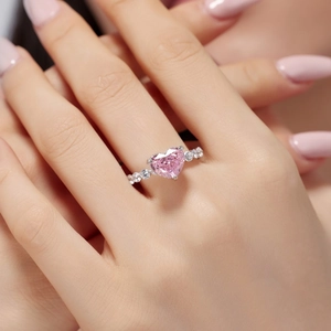 Close-up of S925 sterling silver ring with pink heart stone and zircon accents