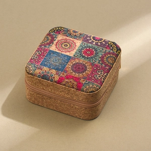 Detail of cork jewelry box featuring a colorful mandala pattern and zip closure