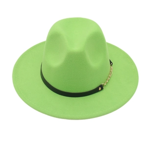Detail of neon green fedora hat featuring black leather band and gold chain accent
