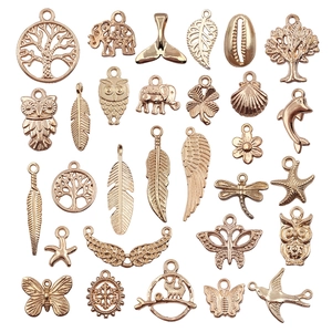 Assorted DIY vintage gold zinc alloy charms including tree of life and animal shapes
