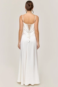 Detailed back view of white satin evening dress featuring an elegant lace-up corset design