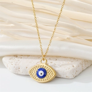 Elegant gold stainless steel evil eye necklace on white silk and natural stone