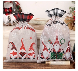 Close-up of Christmas gnome gift bags with plaid trim and festive drawstring closure