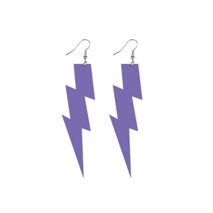 Macro shot of large purple lightning bolt earrings made of acrylic with silver ear hooks