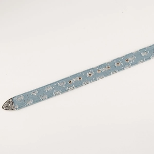 Detail of light blue denim belt featuring distressed fabric, silver sequins and metal eyelets