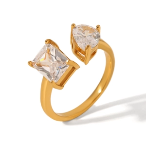 Detailed close-up of 18K gold-plated ring with emerald and pear-cut zircon crystals