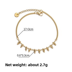 Detail of 14K gold tassel beaded bracelet with 17+3cm chain length and 2.7g weight