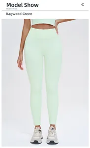 Macro view of seamless high-waist fitness leggings in ragweed green with soft texture