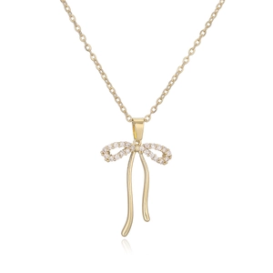 Elegant gold plated bow pendant necklace with sparkling cubic zirconia on a cable chain