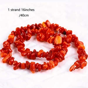 Close-up of a 16-inch strand featuring irregular polished red coral crystal beads