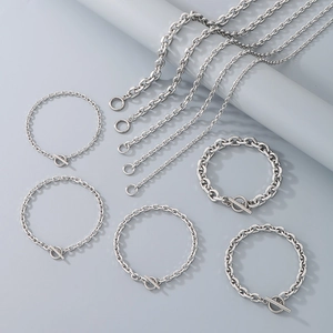 Detail of stainless steel O-chain necklaces and bracelets set with toggle clasps