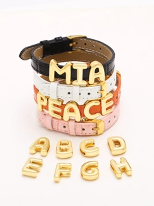 DIY charm bracelet with gold-plated metal letters and textured animal-print leather straps