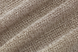 Close-up detail of khaki knitted fabric texture showing premium weave pattern