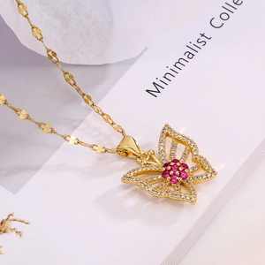 Gold plated butterfly pendant necklace with pink zircons on minimalist card