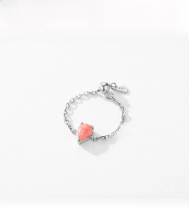 Detail of S925 sterling silver chain ring featuring a teardrop pink opal stone