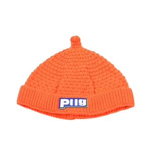 Bright orange knit beanie hat for toddlers with cute top detail and letter patch