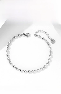Detailed macro view of silver steel oval bead chain with lobster clasp and extension chain