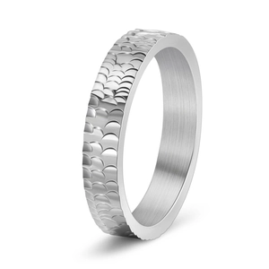 Macro detail of silver ring with 3D dragon scale texture and brushed interior finish