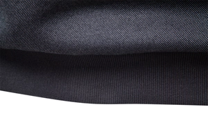 Detail of navy blue piqué fabric and ribbed hem on a men's fleece-lined sweatshirt
