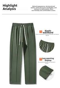 Detail view showing elastic waistband with white drawstring and straight hem of olive pants