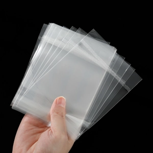 Close-up of clear plastic self-sealing jewelry bags showing texture and zip lock