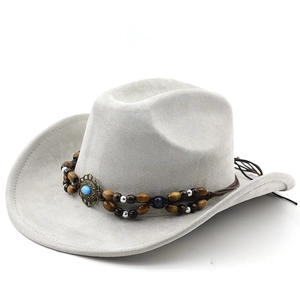 Detail of grey suede cowboy hat with bohemian turquoise beadwork and wide brim