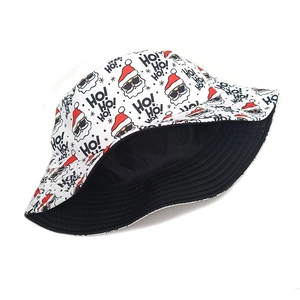 Detail of reversible bucket hat showing cartoon Santa Claus print and black lining