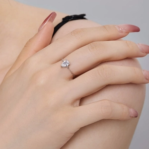 Detailed macro view of S925 sterling silver chain ring with a pear-cut zircon stone