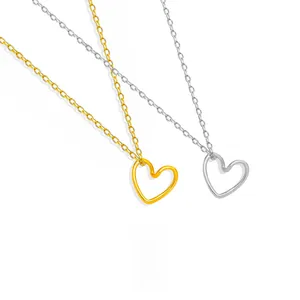 Detailed view of hollow twisted heart pendants in gold and silver stainless steel