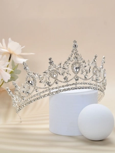 Macro shot of silver bridal crown featuring sparkling rhinestones and crystal details