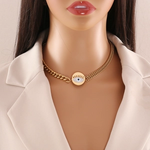 Gold chunky chain necklace with evil eye pendant and zircon stones on a model