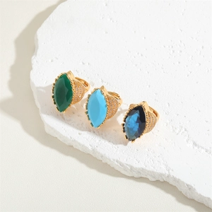 Three marquise zircon open rings in green and blue colors with gold pave setting