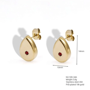 Detail view of 18k gold plated stainless steel teardrop studs with red zircon stone
