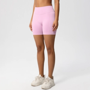 Close-up of pink high-waisted seamless yoga shorts showing squat-proof ribbed waistband