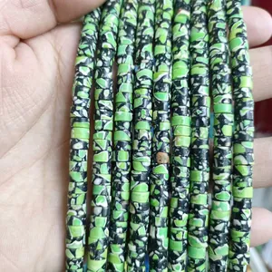 Macro shot of 3x6mm green mottled natural stone spacer beads for DIY jewelry making