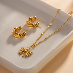18K gold plated stainless steel jewelry set with bow pendant necklace and hoop earrings