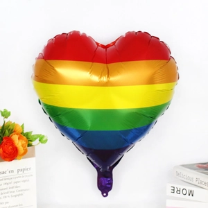 Rainbow heart-shaped foil balloon with colorful horizontal stripes for party decoration