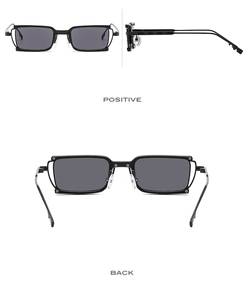Detail view of rectangular sunglasses showing metal frame construction and black finish