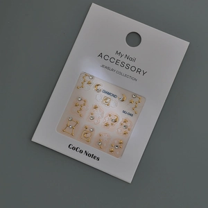 3D constellation nail art stickers with gold moons, stars, and crystals on card