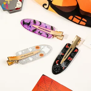 Three-piece Halloween hair clip set with glitter bats and ghosts on acrylic alligator clips