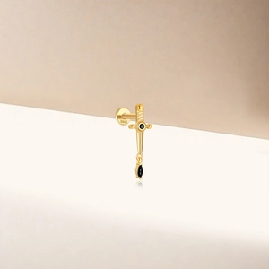 Detailed view of golden S925 sterling silver sword earring with black gemstone inlay
