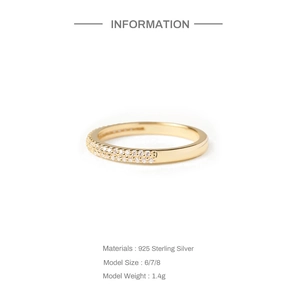 Detailed view of S925 sterling silver ring with delicate diamonds and gold finish