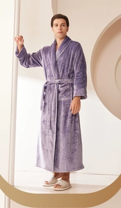 Detail of purple flannel robe with soft coral fleece texture, belt and double pockets