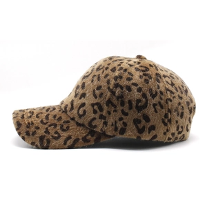 Close-up of leopard print faux fur texture and stitching on a warm winter baseball cap