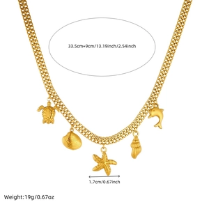 Gold ocean themed necklace with starfish and turtle pendants and size measurements