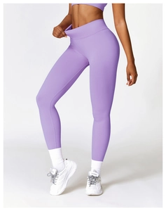 Detailed texture of seamless high-waist purple yoga leggings with tummy control feature