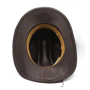 Detail of the brown suede cowboy hat interior with stitched brim and tan sweatband