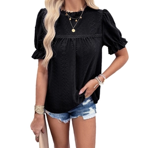 Women's black short sleeve top with textured puff sleeves and ruffled mock neck