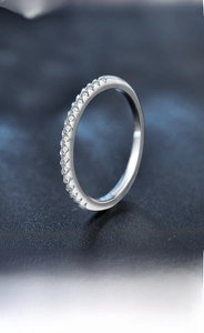 Close-up of S925 sterling silver band showing detailed prong setting and small stones